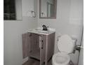 Bathroom featuring a new vanity and fixtures, and a standard toilet at 1440 Hackl Blvd, Bartow, FL 33830
