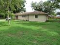 Exterior view showing a single story home with a well kept lawn and an attached garage at 1440 Hackl Blvd, Bartow, FL 33830