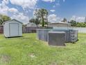 Backyard featuring above-ground pool, storage shed, and plenty of green space at 1685 Kissengen Ave, Bartow, FL 33830