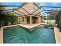 Inviting screened-in pool and jacuzzi area, perfect for relaxation and outdoor enjoyment in a private backyard setting at 228 Magneta Loop, Auburndale, FL 33823