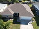 Bird's eye view displays the home's architectural design, backyard, and surrounding neighborhood at 244 Kings Pond Ave, Winter Haven, FL 33880