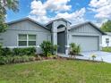 Charming single story home with a manicured lawn and tasteful landscaping in front at 257 Padgett N Pl, Lakeland, FL 33809