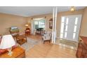 Bright and inviting living room with hardwood floors, a large window, and a comfortable seating area at 3315 Cross Fox Dr, Mulberry, FL 33860