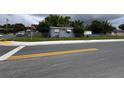 Charming single-story home situated on a corner lot, surrounded by lush greenery at 337 Pearl St, Lake Wales, FL 33853