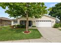Well-maintained one-story home with landscaped front yard, inviting entrance, and attached two-car garage at 3370 Highland Fairways Blvd, Lakeland, FL 33810