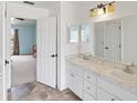 Bright bathroom boasting a double vanity and tiled floors at 367 Cloverdale Rd, Winter Haven, FL 33884