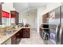 Well-lit kitchen featuring stainless steel appliances and granite countertops at 367 Cloverdale Rd, Winter Haven, FL 33884