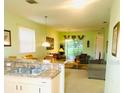Open-concept living area with combined kitchen, dining, and living spaces, offering a bright and airy feel at 4102 Lake Marion Golf Resort # 4102, Kissimmee, FL 34759