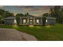 Charming single-story home featuring a welcoming front porch with swing and well-manicured landscaping at 59 Jimmy Lee Rd, Winter Haven, FL 33880