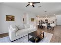 Open-concept living space with view into kitchen and dining area at 6261 Great Bear Dr, Lakeland, FL 33805