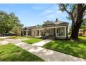 Street view showcasing the home's covered front porch and proximity to neighboring properties at 918 South Blvd, Lakeland, FL 33803
