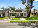 Charming single-Gathering home with a covered front porch, walkway and well maintained lawn at 918 South Blvd, Lakeland, FL 33803