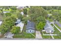 An aerial view of the property surrounded by lush greenery in a quiet neighborhood at 980 S Mill Ave, Bartow, FL 33830