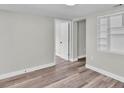 Finished basement featuring wood-look floors, and built in shelving at 980 S Mill Ave, Bartow, FL 33830