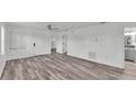 Bright and airy living room with modern flooring and neutral tones throughout the space at 1050 Reynolds Rd, Lakeland, FL 33801