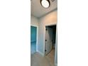 Hallway with neutral walls and white doors at 1683 Sw 3Rd St, Ocala, FL 34471