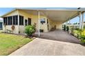 Welcoming home with a carport and a convenient ramp for easy access at 1811 Sherwood Hill Dr, Lakeland, FL 33810
