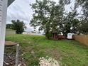 Large backyard with lots of storage space with sheds and mature trees at 1938 Lavon St, Lakeland, FL 33805