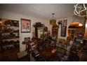 Eclectic living room with vintage decor and unique furnishings at 240 Lake Thomas Dr, Winter Haven, FL 33880