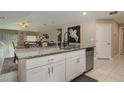 Spacious kitchen island with granite countertop, stainless steel dishwasher, and open layout at 2958 Flying Blackbird Rd, Bartow, FL 33830