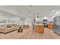 Spacious open-concept layout with a seamless flow between the living area and modern kitchen at 3235 Sandpiper Ln, Mulberry, FL 33860