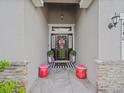Inviting front porch area with decorative accents and a charming entrance at 4340 Reding Way, Lakeland, FL 33813