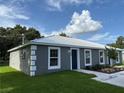 Exterior side view of gray duplex with a silver roof and manicured lawn shows the property's dimensions at 508 & 510 2Nd Sw St, Fort Meade, FL 33841