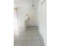 Bright foyer with tile flooring, a closet, and white walls at 624 Brockton Dr, Kissimmee, FL 34758