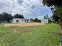 Large backyard featuring a shed, open patio area, and plenty of green space at 6507 Shadowbrook Run, Lakeland, FL 33813