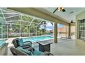 Relaxing screened-in pool area with comfortable seating and a stylish patio at 6757 High Grove Dr, Lakeland, FL 33813