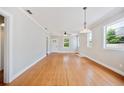 Bright living room featuring hardwood floors, crown molding, and a ceiling fan at 783 E Central Ave, Eagle Lake, FL 33839