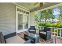Relaxing covered porch with comfortable seating, perfect for enjoying the outdoors and a lovely view at 1018 E Highland Dr, Lakeland, FL 33813