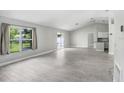Spacious living room featuring tile floors, large windows, and an open layout at 169 Birmingham Dr, Kissimmee, FL 34758