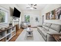 Bright living room with a decorative fireplace, neutral color palette, and ample natural light at 213 Cannon St, Lakeland, FL 33803