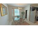 Dining room features modern table and chairs, tile floors, and ample natural light at 2169 Rush Bay Way, Orlando, FL 32824