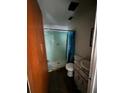 Bathroom features a stand-up shower, a white toilet, and a damaged vanity at 2921 Galaxy Ln, Lakeland, FL 33801