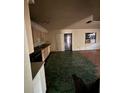 Bright kitchen with laminate floors, ample cabinet space, and a door leading to the backyard at 2921 Galaxy Ln, Lakeland, FL 33801