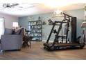 Inviting living room featuring a home gym, comfortable seating, and stylish decor at 301 Orange Blossom Dr, Winter Haven, FL 33880