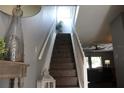 Bright staircase with a modern design and decor leading to a sunlit upper level at 301 Orange Blossom Dr, Winter Haven, FL 33880