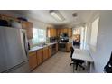 Functional kitchen with stainless steel appliances, ample counter space, and convenient access to additional rooms at 3100 Abaco St, Orlando, FL 32827