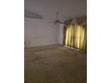 Large living room featuring a ceiling fan and large window at 341 Sterling Dr, Winter Haven, FL 33884