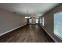 Bright living room with contemporary flooring, neutral walls, and ample natural light at 4042 Old Bartow Eagle Lake Rd, Bartow, FL 33830
