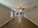 Spacious living room with modern flooring and a ceiling fan at 4042 Old Bartow Eagle Lake Rd, Bartow, FL 33830