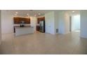 Open concept kitchen with stainless steel appliances and center island at 6524 Great Bear Drive Blvd, Lakeland, FL 33805