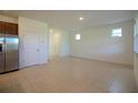 Open-concept living area with tile flooring and neutral walls creates a bright and airy atmosphere at 6524 Great Bear Drive Blvd, Lakeland, FL 33805