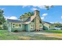 Well-maintained home features a unique stone chimney design at 6533 Angus Dr, Lakeland, FL 33810