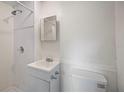 Well-lit bathroom with shower, single vanity, and modern toilet at 1133 Bryn Mawr Ave, Lake Wales, FL 33853