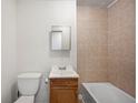 Bathroom featuring a tiled shower, vanity, toilet, and clean finishes at 1133 Bryn Mawr Ave, Lake Wales, FL 33853