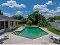 Refreshing pool surrounded by lush landscaping and comfortable lounging areas at 1232 Fairlee St, Lakeland, FL 33813