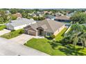 Charming single-Gathering home with a well-maintained lawn and a spacious two-car garage at 2812 Whitney St, Lakeland, FL 33813